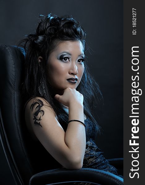 Gothic asian girl on black background