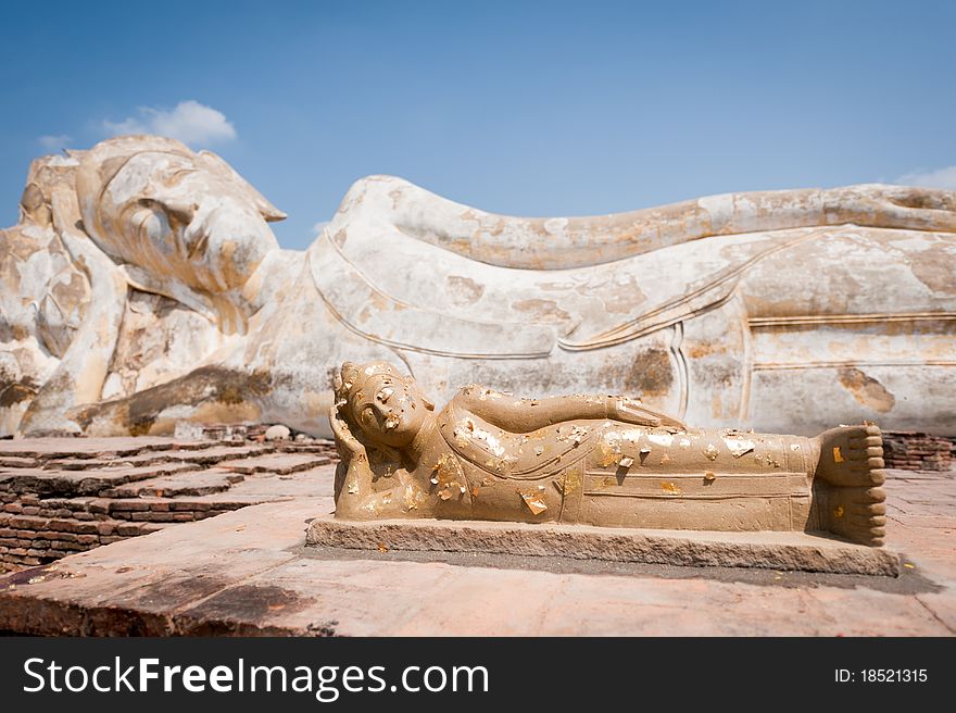 The Reclining Buddha (Phra Budhasaiyart) in Ayutthaya, Thailand, represented the moment at which a giant named Asuridarahu was unwilling to pay respect tot he Buddha because he was proud of his huge body. The Buddha desired the giant to be less arrogant, so he turned himself as much larger than the giant.