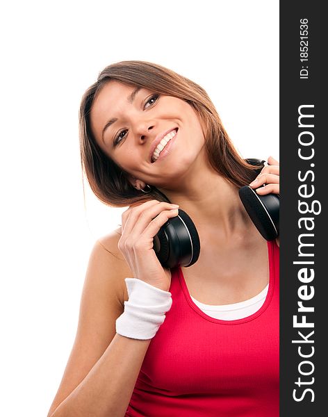 Sexy caucasian brunette woman listening and enjoying music in earphones headphones, smiling, laughing and looking away from camera isolated on a white background