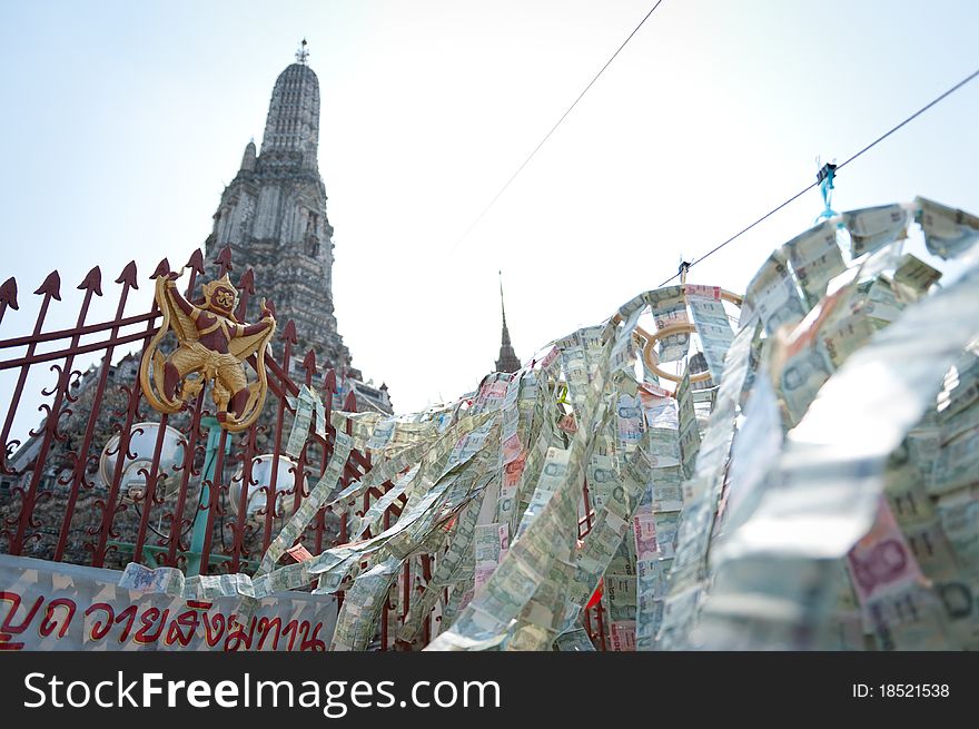 Paper money blessings decorate the temple of Wat Arun in Bangkok.