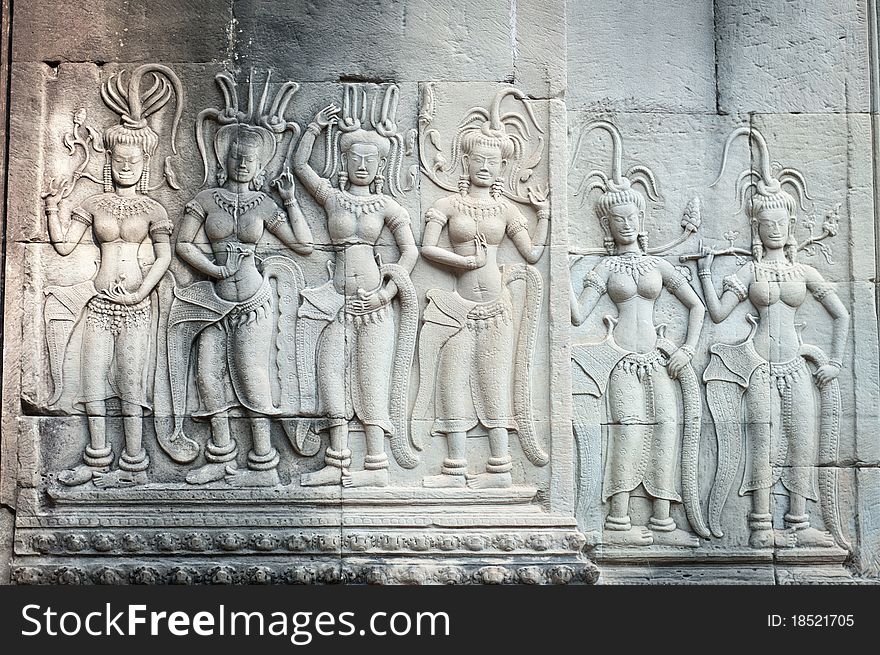 Apsaras, or celestial dancing girls, play out an eternal dance engraved in the ancient walls of Angkor, Cambodia. Apsaras, or celestial dancing girls, play out an eternal dance engraved in the ancient walls of Angkor, Cambodia.