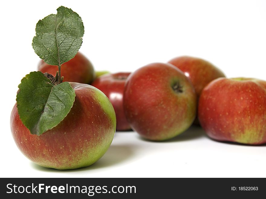 Apples with leafs on white background. Apples with leafs on white background