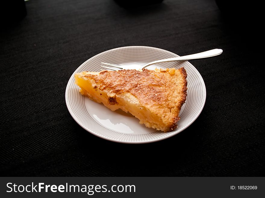 Piece of lemon cake on a plate with fork