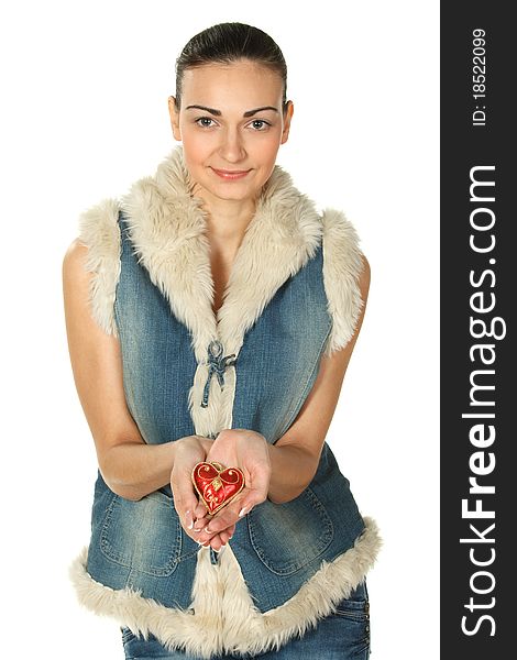 Portrait of young female in blue denim holding heart shape isolated on white. Portrait of young female in blue denim holding heart shape isolated on white