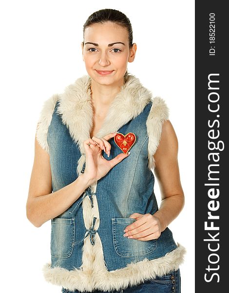 Portrait of young female in blue denim holding heart shape isolated on white. Portrait of young female in blue denim holding heart shape isolated on white