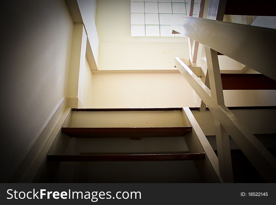 Stair brown walls with white light shining from the windows. Stair brown walls with white light shining from the windows