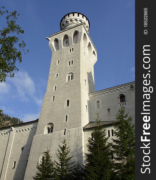 Neuschwanstein Castle is a 19th-century Gothic Revival palace on a rugged hill above the village of Hohenschwangau, Germany. Neuschwanstein Castle is a 19th-century Gothic Revival palace on a rugged hill above the village of Hohenschwangau, Germany