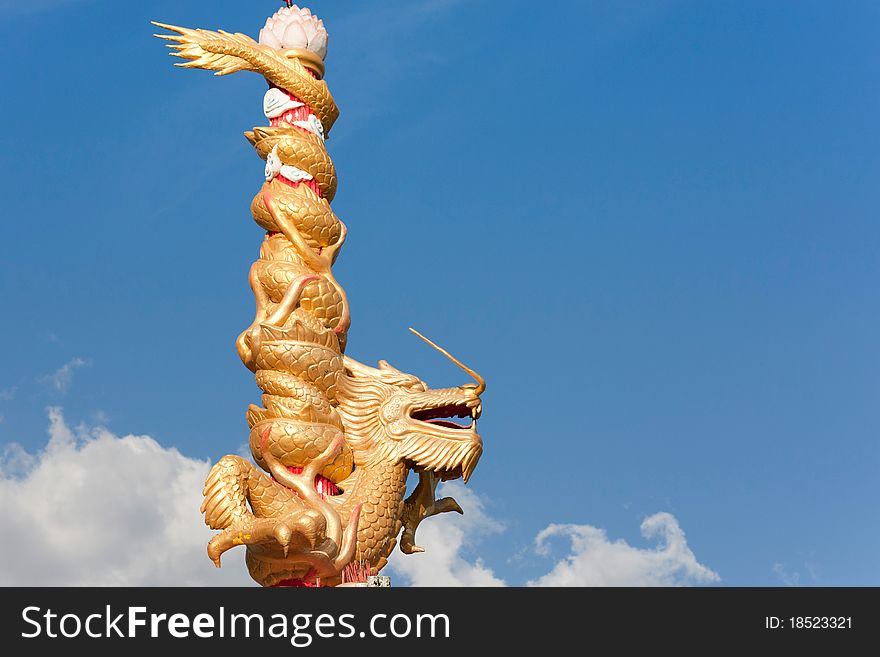 The gold dragon on blue sky