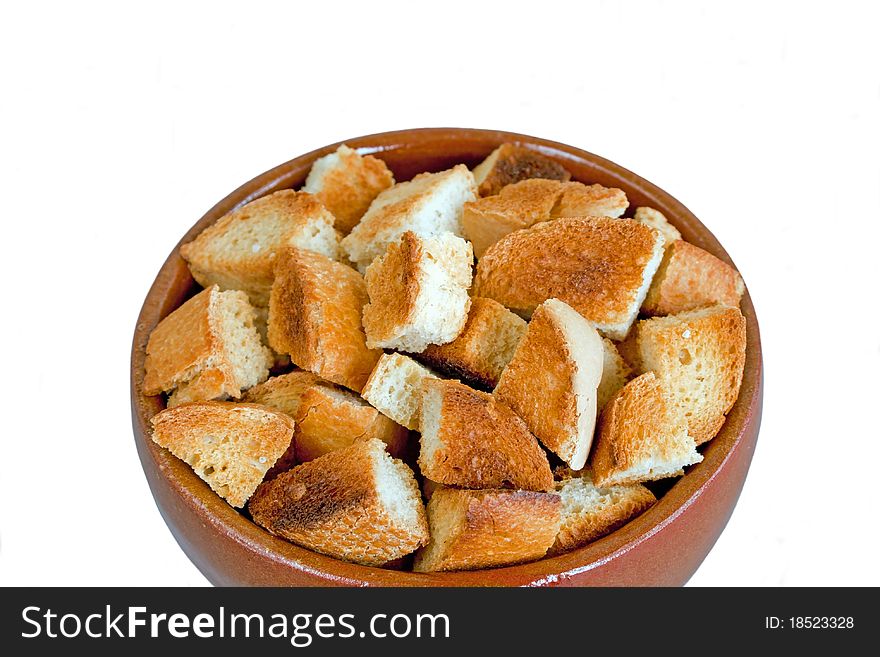 Bread rusk in a ceramic bowl isolated on white