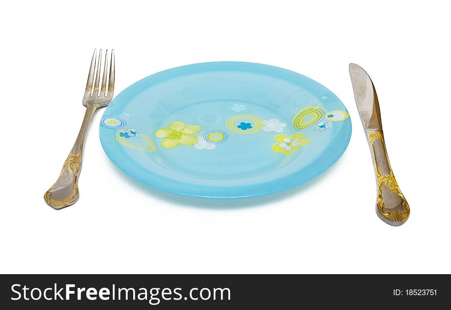 Blue Dish, knife, fork on a white background