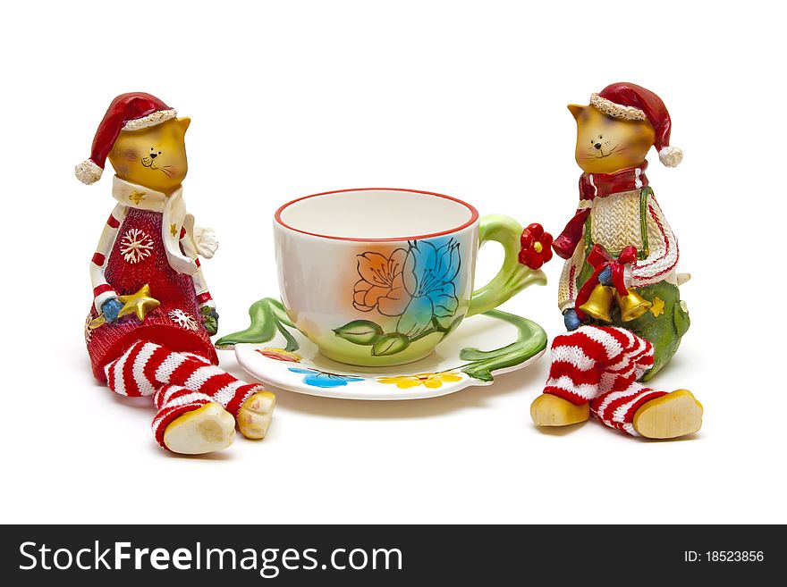 Cats and cup of tea on a white background