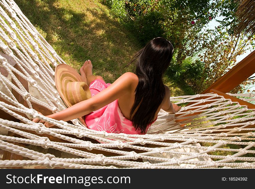 Young woman relaxing in hammock. Young woman relaxing in hammock