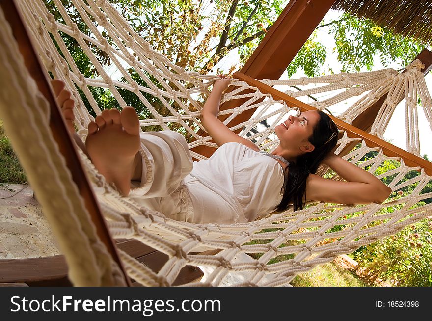 Young woman relaxing in hammock. Young woman relaxing in hammock