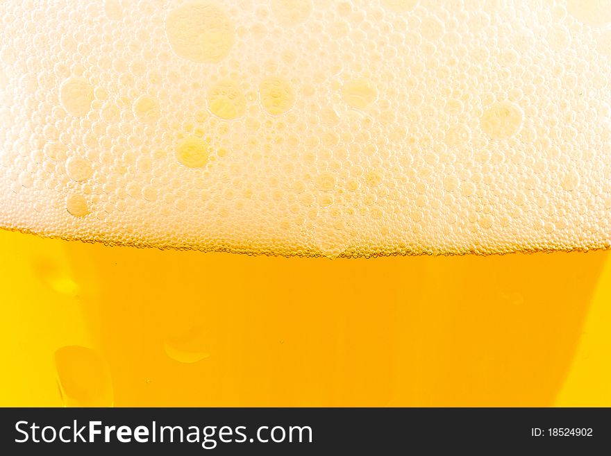 Light beer fresh in a glass of beer close up