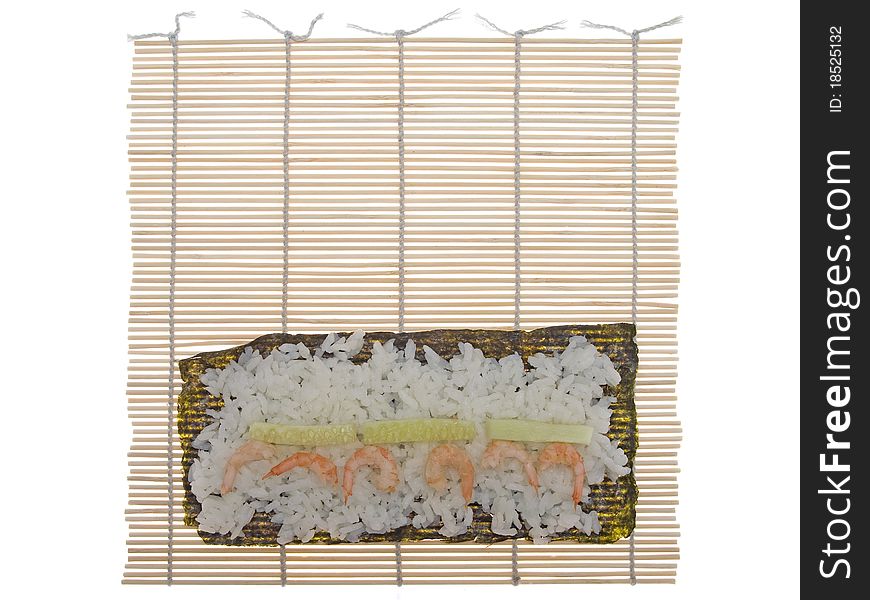 Bamboo mat for cooking sushi isolated on a white backgrownd