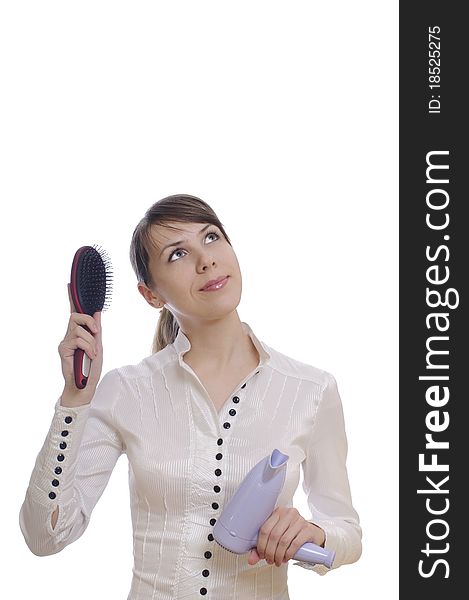 Isolated thinking woman with hairbrush and dryer