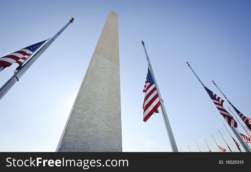 The Washington National Monument, surrounded by a ring of US flags. The Washington National Monument, surrounded by a ring of US flags.