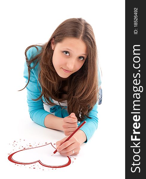 Young woman draws a pencil on a white floor. Isolated on white. Young woman draws a pencil on a white floor. Isolated on white