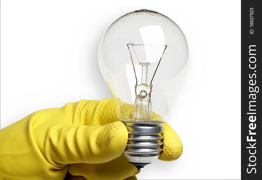 The image shows a human hand with a rubber glove and a bulb over white. The image shows a human hand with a rubber glove and a bulb over white