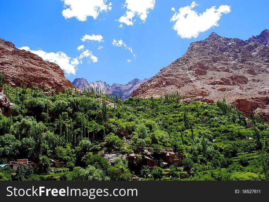 A beautiful landscape of mountains in Himalaya with a greenery in the season of summer. A beautiful landscape of mountains in Himalaya with a greenery in the season of summer.