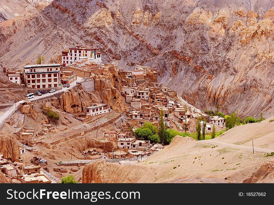 A houses and a monastery building situated in the hills. A houses and a monastery building situated in the hills.