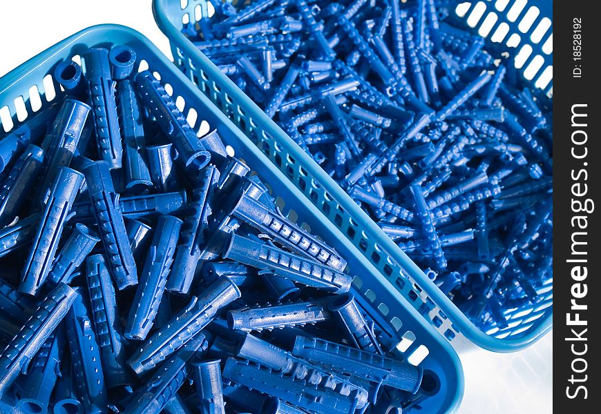 Blue plastic wall plugs in the boxes