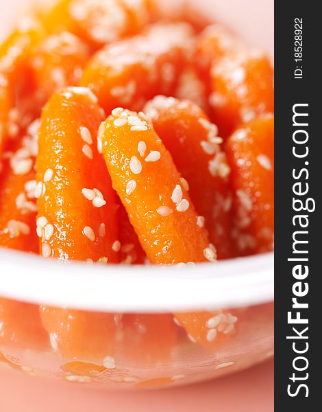 Honey glazed baby carrots with sesame seeds