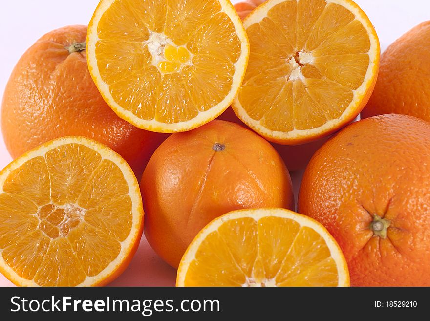 Detail view of a bunch of oranges isolated on a white background.
