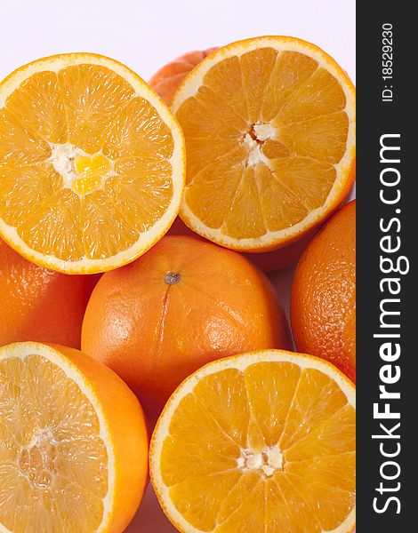 Detail view of a bunch of oranges isolated on a white background.