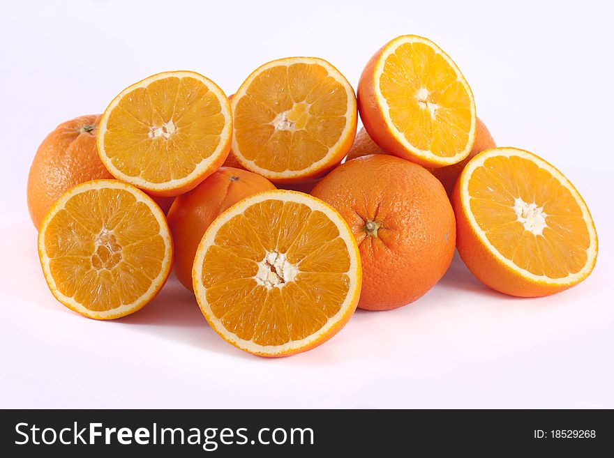 Detail view of a bunch of oranges isolated on a white background.