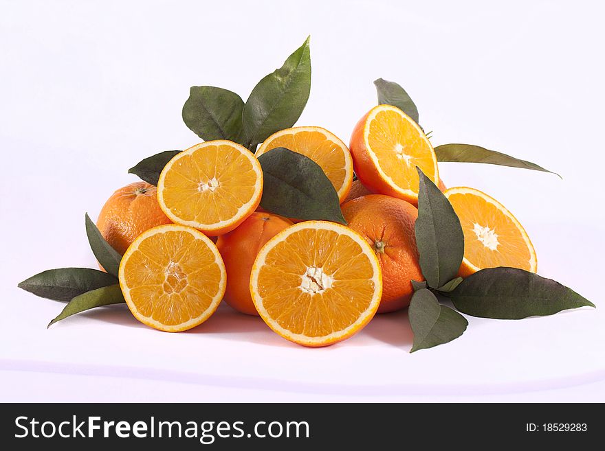 Detail view of a bunch of oranges isolated on a white background.