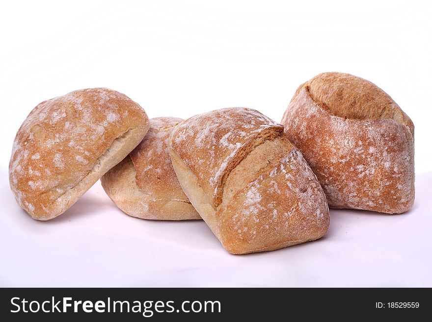 Detail view of a bunch of small portuguese breads, called carcaças. Detail view of a bunch of small portuguese breads, called carcaças.