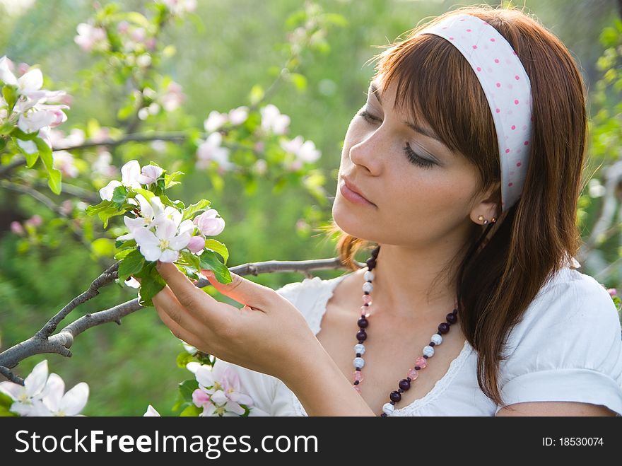 Girl and spring apple blossom