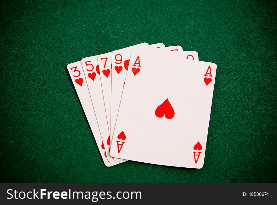 Playing cards on green background, Poker figure - colour