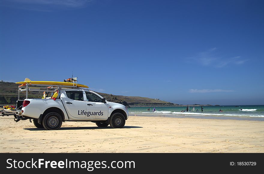 Lifeguards rescue vehicle situated on a beach in cornwall during the summer. Lifeguards rescue vehicle situated on a beach in cornwall during the summer