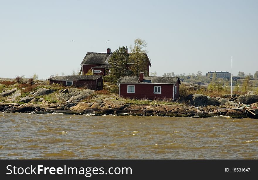 Scandinavian wooden cottages on the coast of Helsinki harbour.