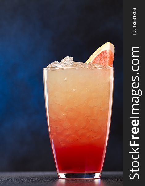 Fresh coctail with grapefruits on a black