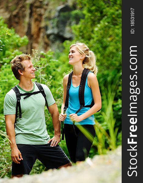 Cute couple have fun together outdoors on a hike. Cute couple have fun together outdoors on a hike