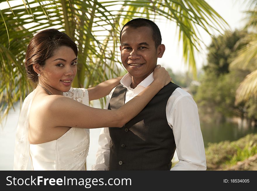 Asian Wedding Couple In Tropical Location