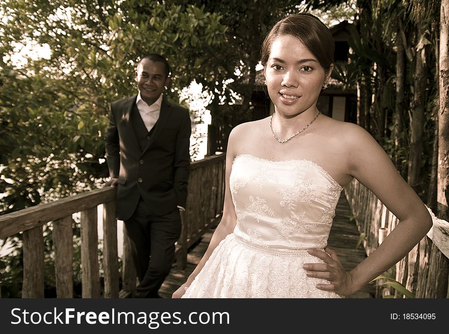 Asian wedding couple in tropical location