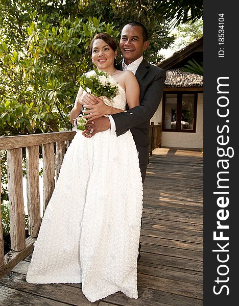 Asian Wedding Couple In Tropical Location