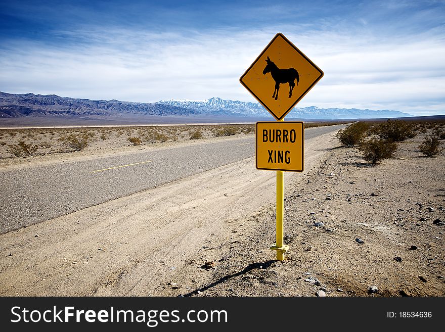 A sign warns careless travelers that donkeys may wander onto a lonely stretch of highway. A sign warns careless travelers that donkeys may wander onto a lonely stretch of highway.