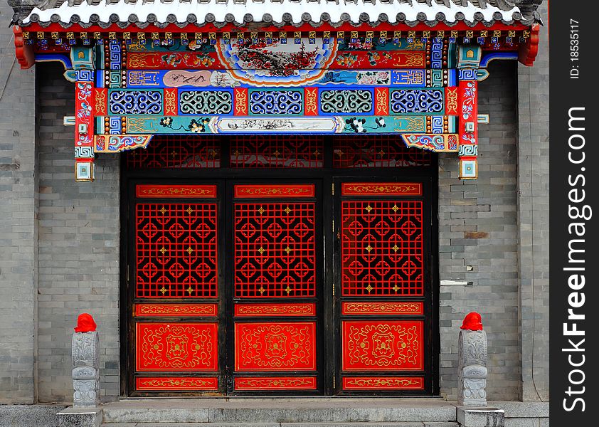 Red Chinese door and covered by snow
