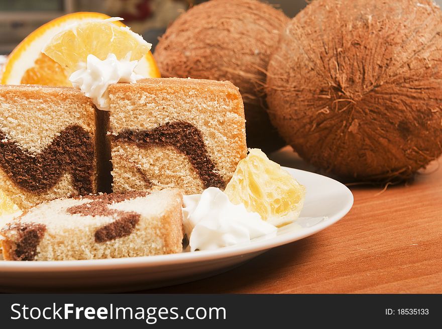 Cake with orange and coconut and cream