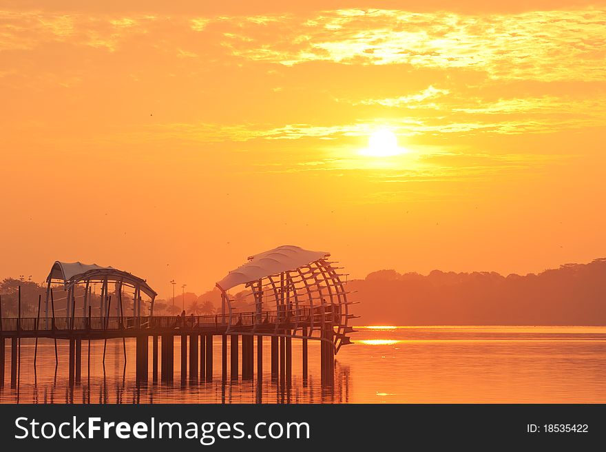 Bold Sunrise Behind A Pier