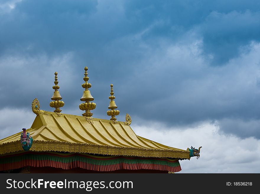 A shot of a gilded monastery roof.