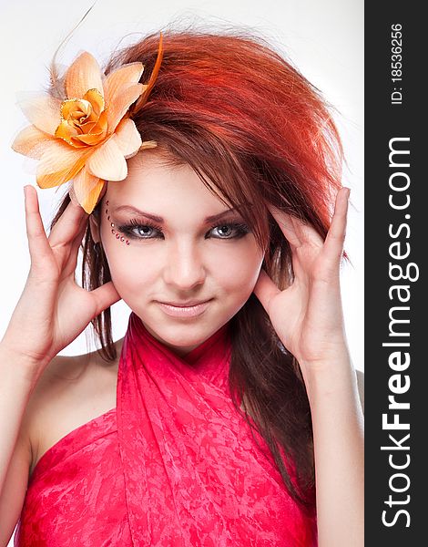 Portrait Of Woman With Flower In Hair On White