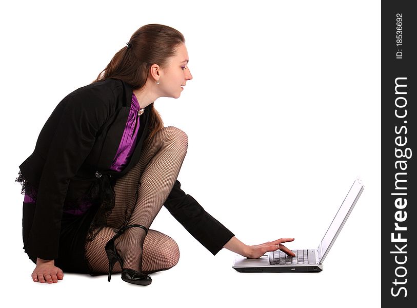 Girl Sits On Floor And Works With Notebook.