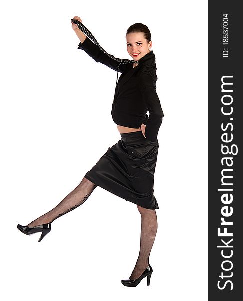 Girl in black suit steps forward holding necktie.