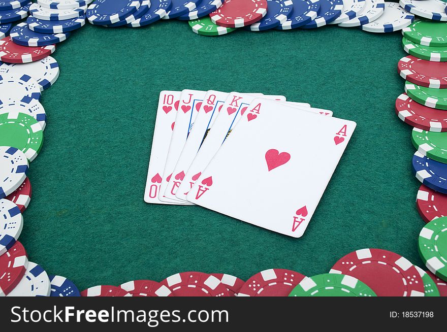 Royal flush and chips on the green table. Royal flush and chips on the green table